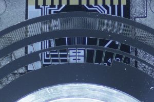 Close up view of optical encoder disc over a photosensor